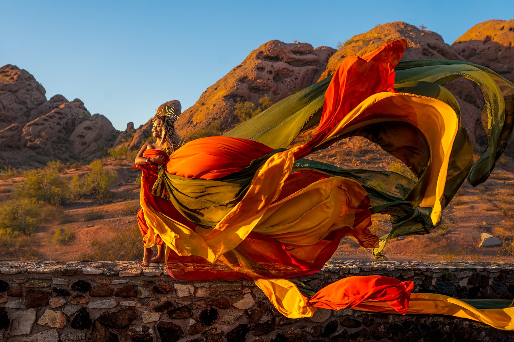 Woman with flowing fabric in the desert, destination portrait session
